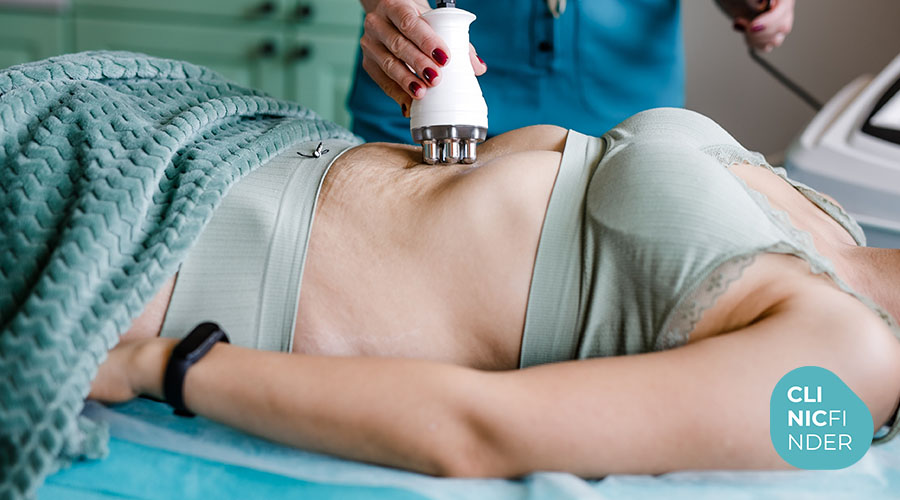 Patient receiving an ultrasound body-contouring treatment to the abdomen