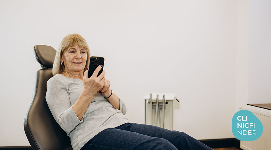 Woman seated in a clinic treatment chair